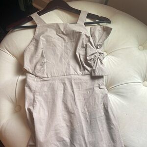 Kate Spate SATURDAY dress, has side cut outs and a signature bow on the side